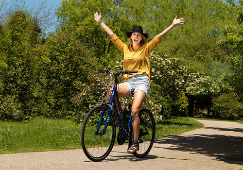Jessica Pearson riding a bike through Nathanael Greene/Close Memorial Park in Springfield MO