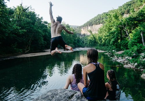 cliff jumping into water