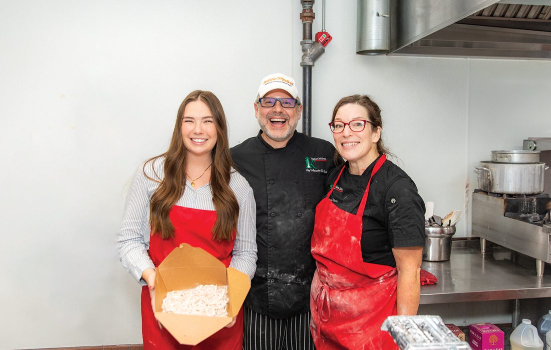 Jordan Blomquist with Italian Kitchen owners.